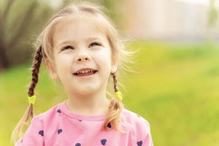 portrait of a 4 year old girl on an open airの写真素材