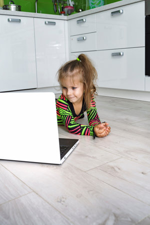 baby does gymnastics at home online. does exercise bridge in front of laptop