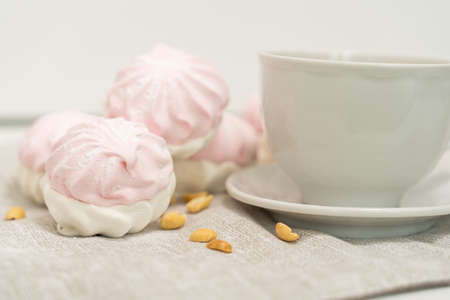 sweet dessert made from marshmallows and a cup of teaの写真素材
