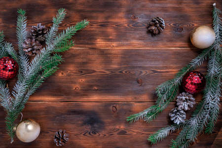 pine cones and branches on a white wooden background. christmas decorations. mock up for christmas conceptの写真素材