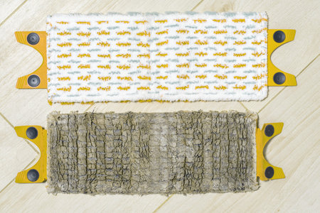 old and new mop cloths lie side by side on the floor