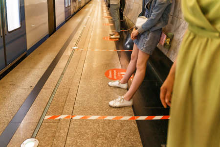 07 01 2020 Moscow, Russia. markings in the Moscow metro. distance 1.5 meters. people stand at the station keeping a social distance.のeditorial素材