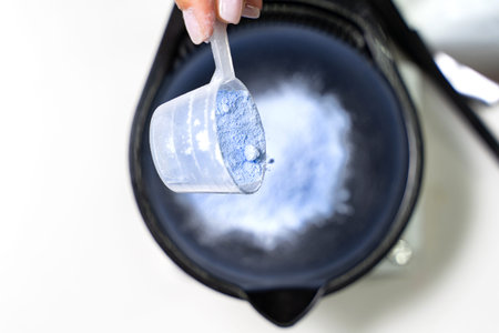 Hairdresser calorist mixes ingredients for hair coloring. hair dyeing process