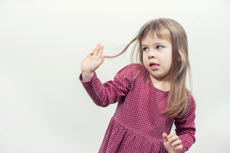 the child says no. hands forward. rejection pose. mock up with copy spaceの写真素材