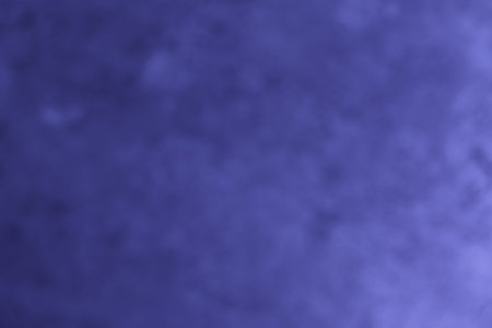 abstract blue blurred background with light large spots of paint and light texture. universal...