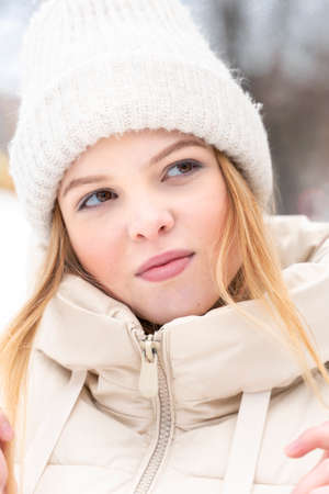 portrait of a teenage girl in winter warm clothes.の写真素材