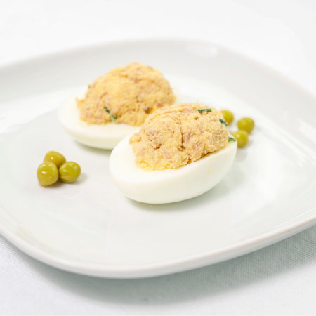 stuffed eggs Nicoise. cooking. half eggs filled with canned tuna filling