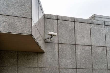 surveillance camera on the facade of the office buildingの写真素材