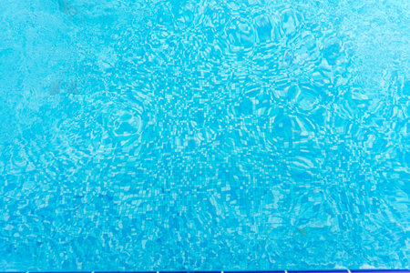 clear blue water in the pool. natural blue background.