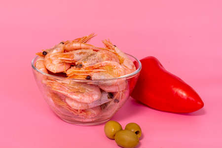 boiled shrimp in a glass bowl and fresh vegetablesの写真素材