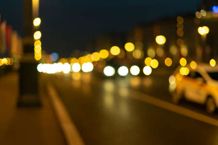 Colorful bokeh of city skyline from the sea in night time. Night bokeh light in big cityの写真素材