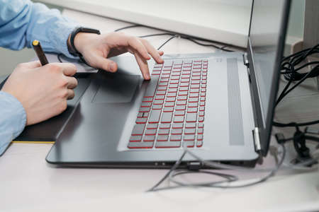 Graphic designer using digital tablet and computer in office. hands close upの写真素材