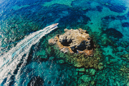 top view of the azure sea cliff boat blue sea beautiful landscape nature travel turkey vacation water ocean beach transparent see the bottomの写真素材
