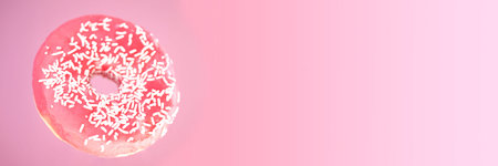 Pink donut with white top on the pink background banner