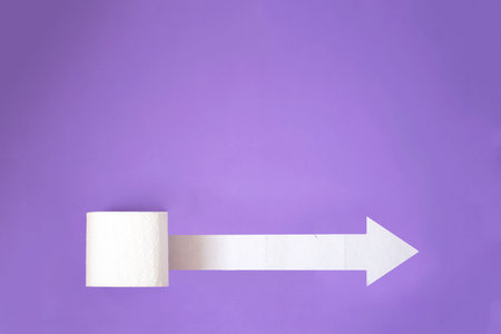 A beautiful roll of toilet paper on the plain background with outer place for adding text