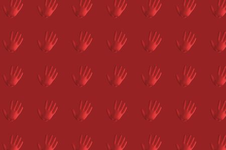 A blue medical glove on the plain backgroundの写真素材