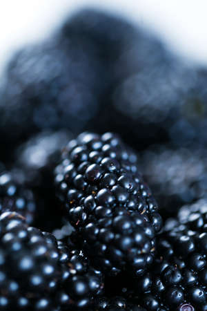 Beautiful fresh blackberry pieces close up summer timeの写真素材