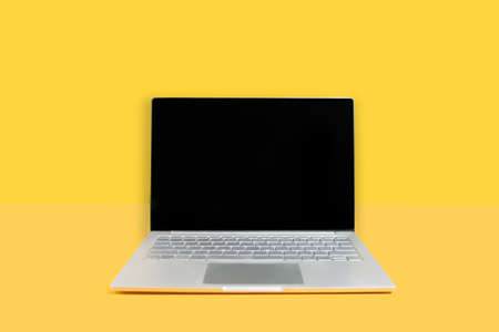 A laptop computer screen mock up on the yellow backgroundの写真素材