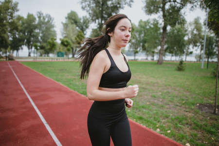Fitness young woman model healthy lifestyle outdoor doing sports workoutの写真素材