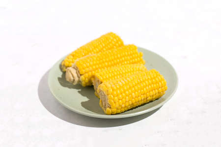 Boiled corn on the cob vegan vegetarian dishの写真素材