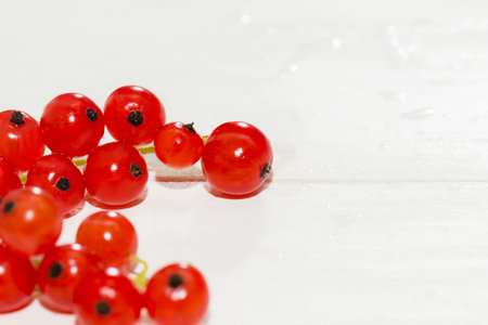 Juicy currant. Fresh red currant isolated on white background, close up.の写真素材