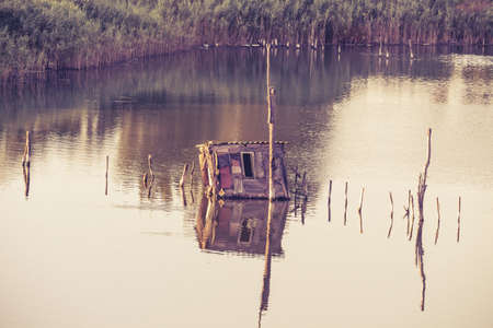 fish farming,traditional fishing nets, Old Fish trap at laguna in Ulcinj in Montenegro. Fisherman Cabins at Port Milena Canal. Old fishing pile dwellings in one of the Adriatic countryの写真素材