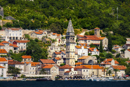 Classic view of the historic town of Perast located at world-famous Bay of Kotor on a beautiful sunny day with blue sky and Balkan mountains in summer, Montenegro, southern Europe.の写真素材