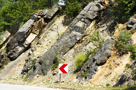 road sign in the mountains, direction, right wayの写真素材