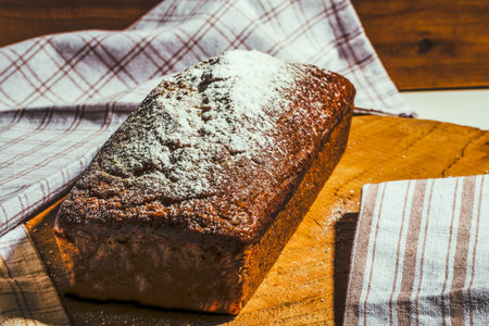 Butter free, sugar free homemade banana bread on wooden background with natural linen napkins, Ideas...
