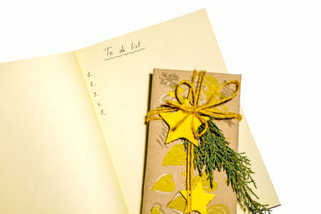 Christmas To Do List with yellow christmas decorations isolated on white background.の写真素材