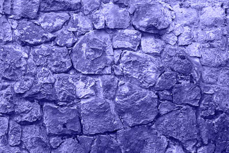 Purple Very Peri ancient stone wall texture background.の写真素材