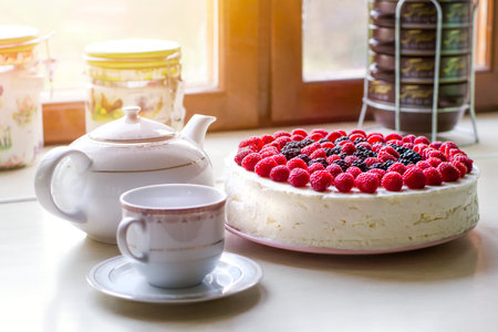 Home mousse cake with cottage cheese and jelly with raspberries and blackberries. The concept of...