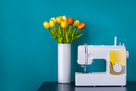 Sewing machine on table in workshop.の写真素材