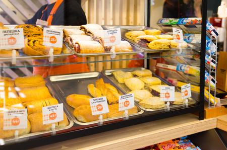 shop window cafe with pastries and price tags in Russianのeditorial素材