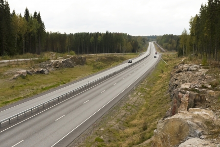Highway among granite rocks in early autumn   Autumn landscape の写真素材