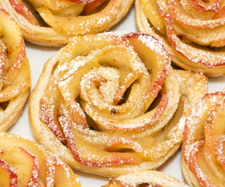 Sweet rolls with apples in the form of roses on plateの写真素材