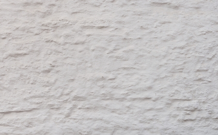 Old white wall stucco texture の写真素材