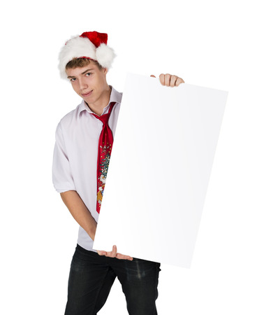 Christmas smiling guy hold white board with empty copy space, concept of advertise new year season shopping sale, wear red hats and tie, isolated over white backgroundの写真素材