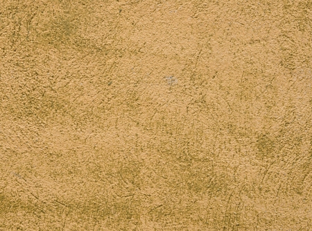 Yellow-green wall stucco texture as background closeupの写真素材
