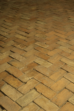 Old vintage paved bricks a floor in the castle as backgroundの写真素材