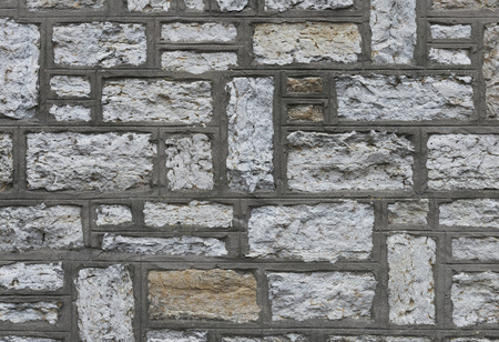 Background of limestone wall texture close upの写真素材