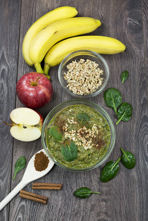 Green smoothie with apples, spinach, banana, germinated buckwheat and cinnamon.Clean eating, fully raw food.の写真素材