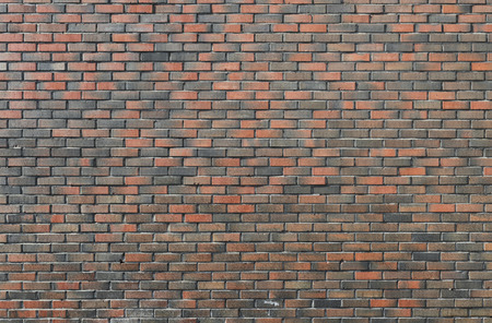 Background of dark vintage brick wallの写真素材
