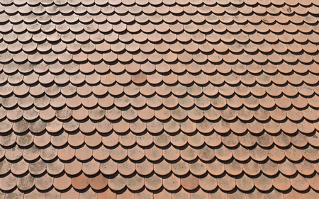The roof is covered with tiles in sunny day as backgroundの写真素材