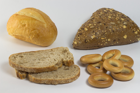 Bun with seeds, white bun, two slices of bread and  bagelsの写真素材