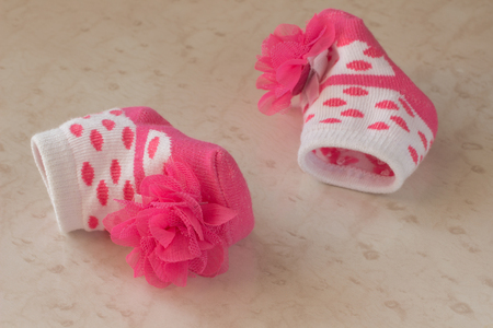 Baby socks with rosesの写真素材