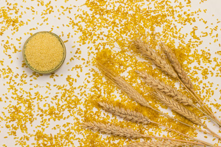 Spikelets of wheat, groats couscous and bulgur.