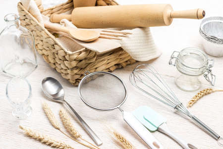 Kitchen utensils for making dough. Spikelets of wheat. Wicker box. White background. Top viewの写真素材