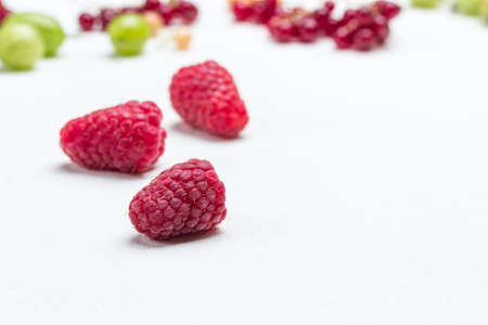 Fresh raspberries on white. Berry background. Copy space. Top viewの写真素材