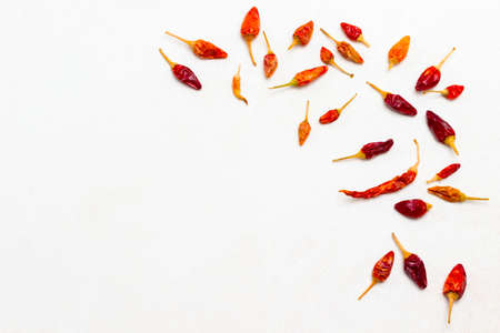 Pods of dry red pepper on white background. Flat lay. Copy spaceの写真素材